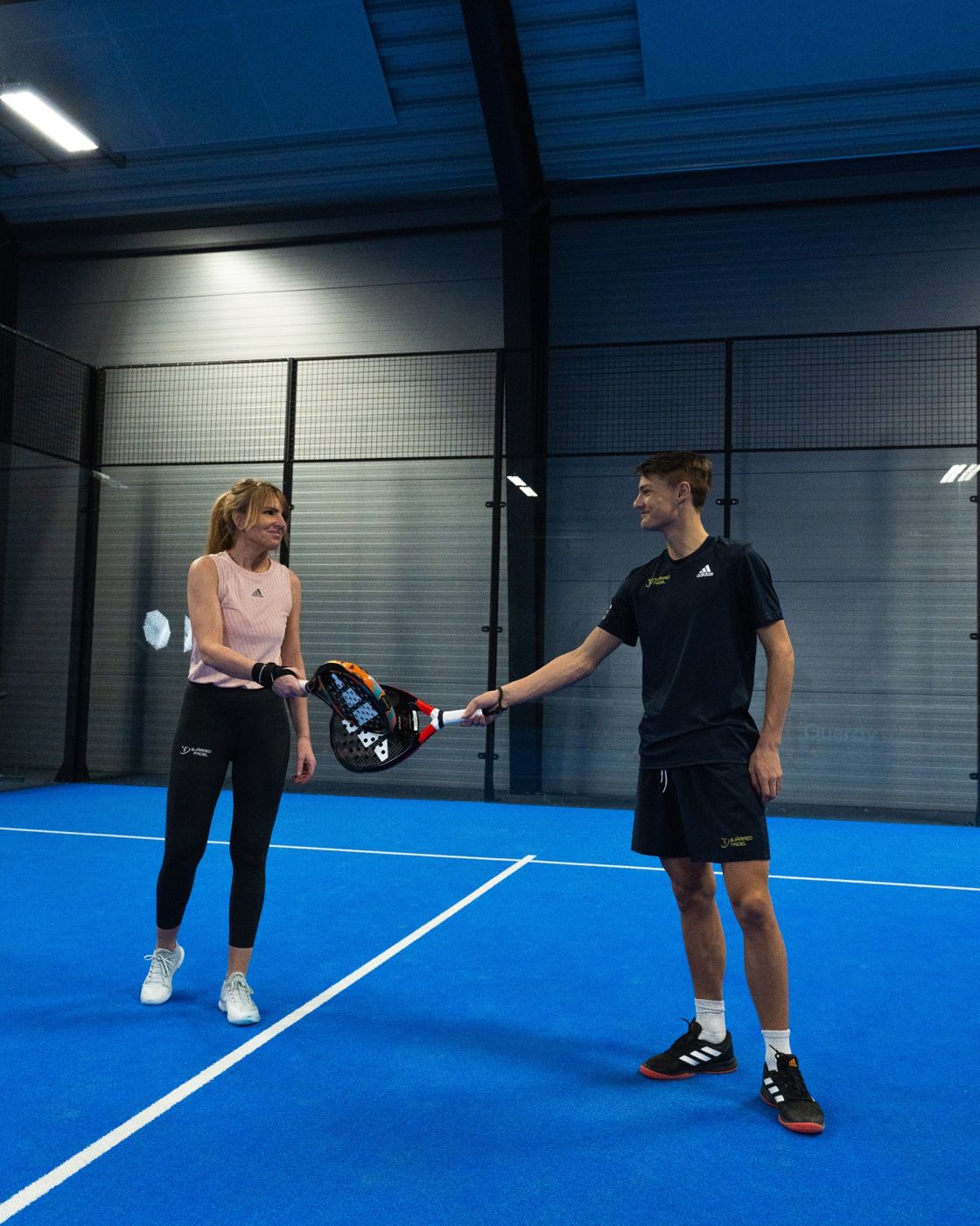 Two players on a court at Bjärred Padel