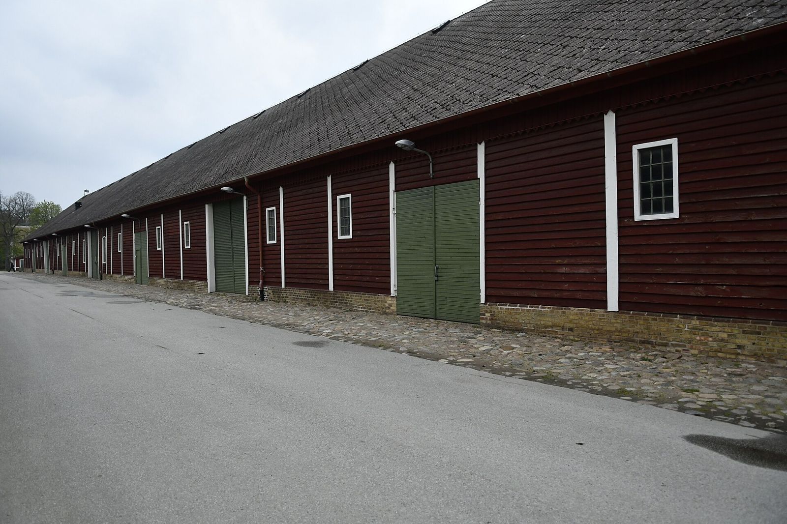 Long red farm buildings at Alnarp in spring