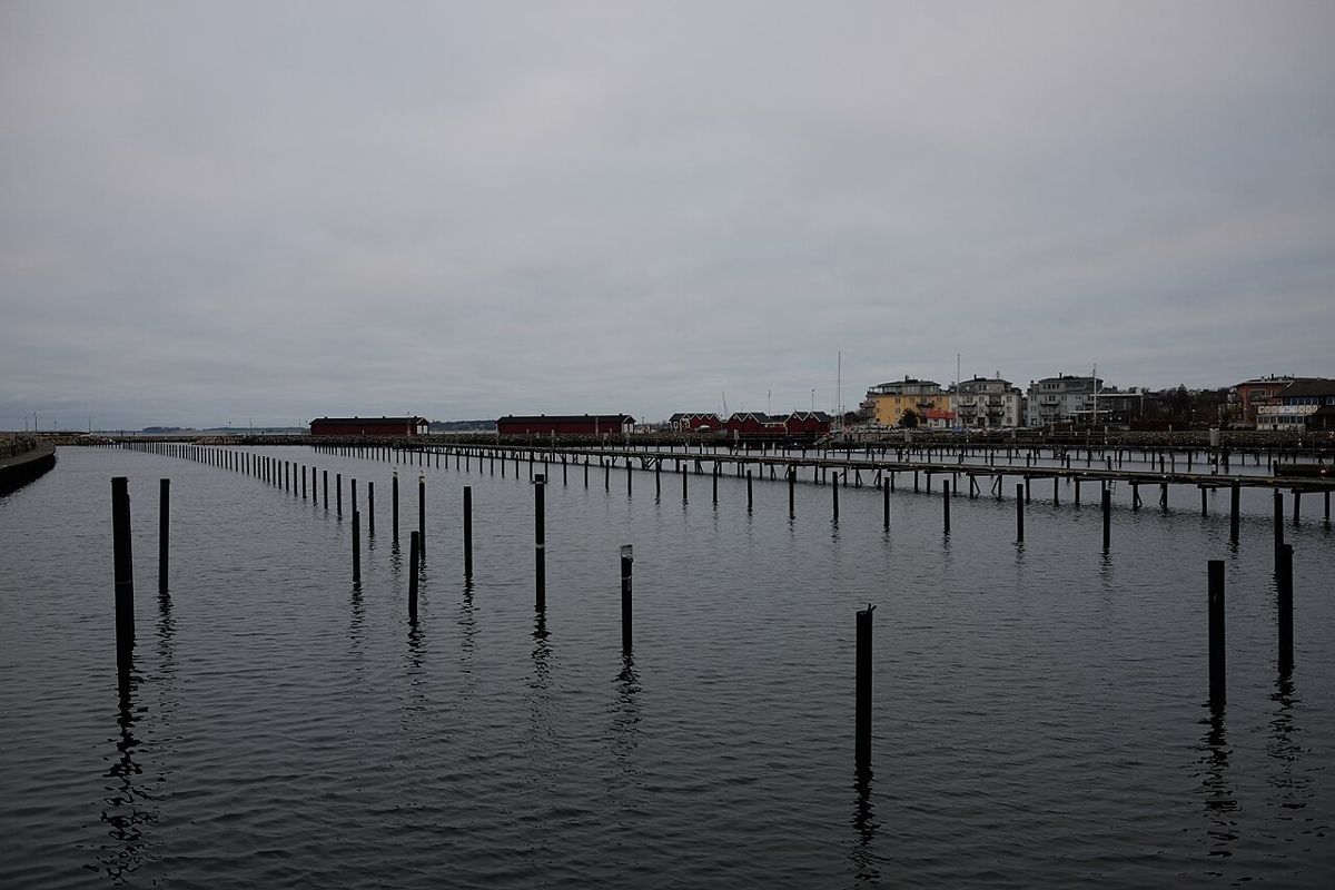 Calm water and mooring posts in Lomma harbour